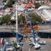 MEXICO CITY, MEXICO - MAY 04: Aerial view of the works to remove the damaged train after a train  overpass collapsed last night killing 23 people on May 04, 2021 in Mexico City, Mexico. The accident happened between Olivos and Tezonco stations of metro line 12 at 10pm local time. (Photo by Hector Vivas/Getty Images)
