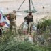 Guardia Nacional desmantela campamento de migrantes.