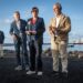 La ministra de Sanidad Mónica García, el ministro de Interior, Fernando Grande-Marlaska, y el titular de Política Territorial y Memoria Democrática, Ángel Víctor Torres, este domingo en el Puerto de Granadilla, con el crucero 'MV Hondius' de fondo.